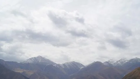 Mountain with some cloud on the blue clear sky Stock Photos