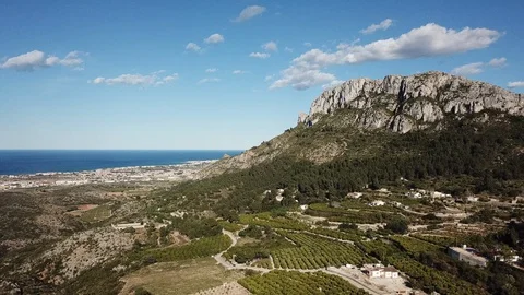 Mountain on spain coast - fly-through landscape towards sea Stock Footage 128675564