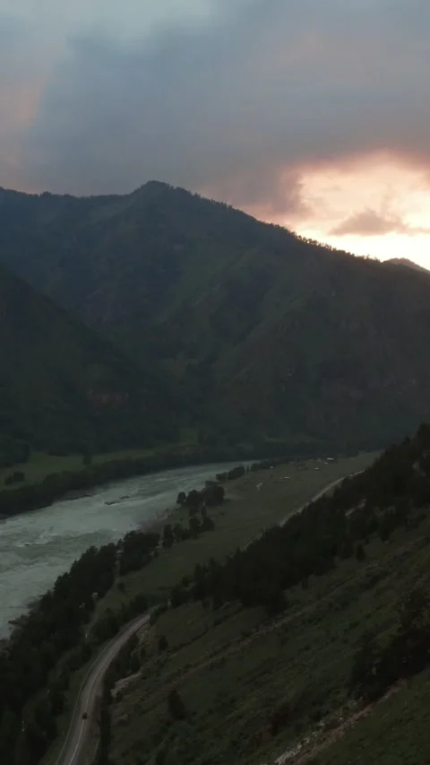 Mountain Spirits Gorge in Altai with river valley and dramatic sunset clouds Stock Footage 335660484