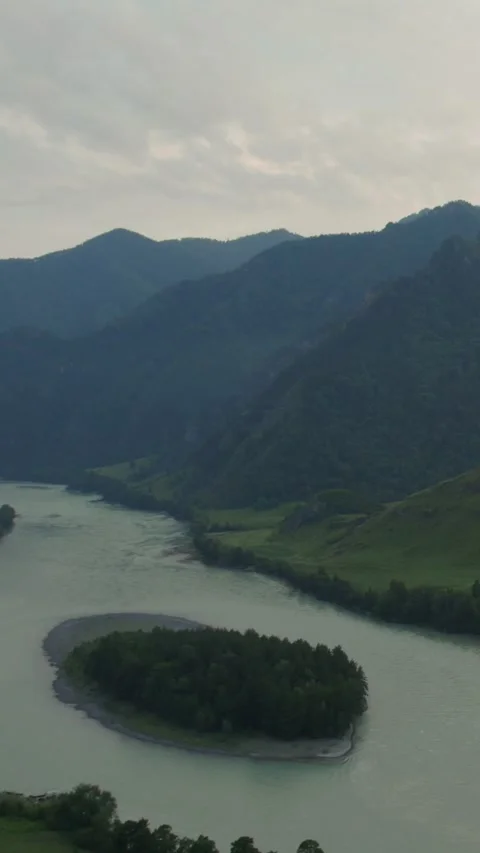 Mountain Spirits Gorge in Altai with winding river and forested hills at dusk Stock Footage 335662245