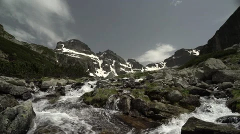 Mountain Spring and Alpine Peaks 4K Stock Footage 64771935