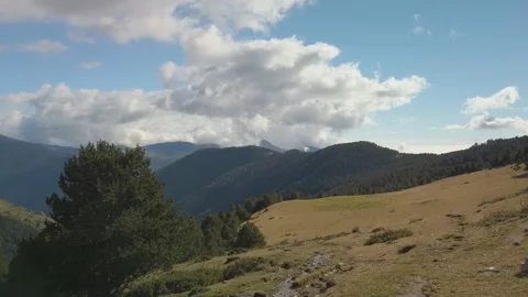 Mountain spring landscape in a sunny day with some clouds Stock Footage 180985548