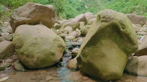 Mountain Spring Water Flowing Over Rocks in Natural Landscape Stock Footage 314676837