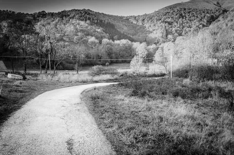 Mountain srada between two meadows in black and white Stock Photos