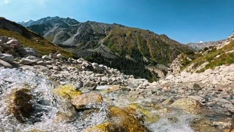 Mountain stream against a backdrop of peaks 動画素材 317688400