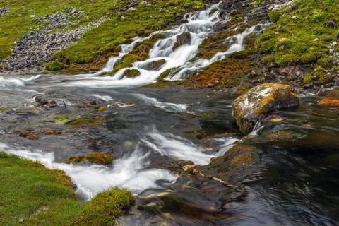 Mountain stream and meadow Foto stock