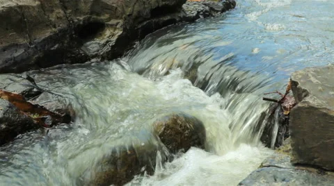 Mountain stream between stones. Little rapids. Stock Footage 57586538