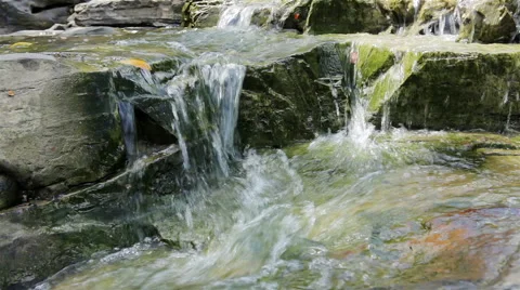 Mountain stream between stones. Little rapids. Stock Footage 57600346