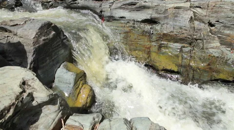 Mountain stream between stones. Little rapids. Stock Footage 57605675