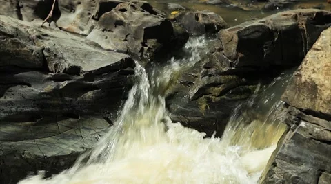 Mountain stream between stones video. Stock Footage 50365635