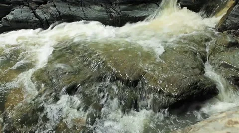 Mountain stream between stones video. Stock Footage 50365761