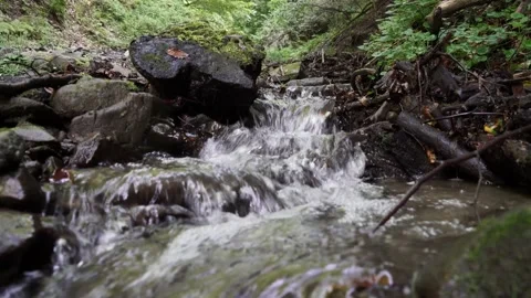 A mountain stream breaks through the rocks in the Carpathians 4 k 動画素材 138867330