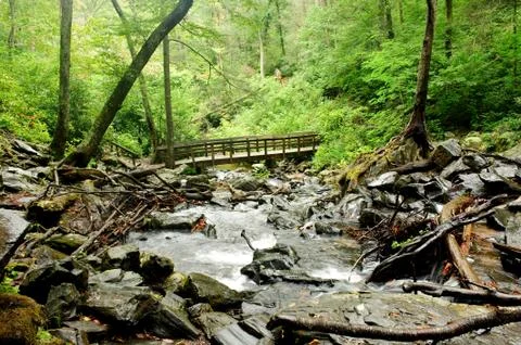 Mountain stream bridge Stock Photos