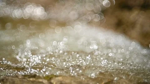 A mountain stream with bubbles and bokeh (slow motion) Stock-Footage 219641966