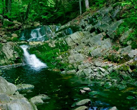 Mountain stream cascades Stock Photos
