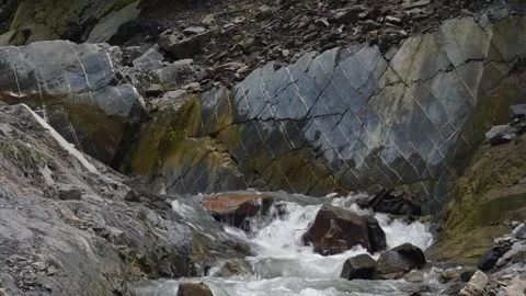 Mountain Stream Cascading Over Unique Rocky Formations in Dagestan Stock Footage 325819511