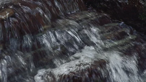 Mountain stream close up. Crystal clear water flowing on rocks. 4K + audio Stock Footage 160629944