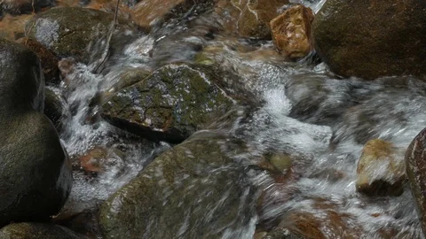 Mountain stream creek flowing through rocks. Stock Footage 93046410