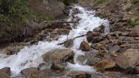 Mountain stream down steep rocky ravine. Stockbeeldmateriaal 117574803