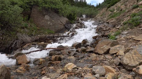 Mountain stream down steep rocky ravine. Stockbeeldmateriaal 117580237