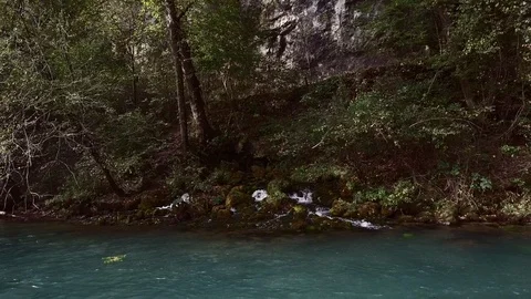 Mountain stream entering river neat Big Spring Missouri Video stock 113520859