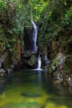 Mountain stream fall through the rock Stock Photos