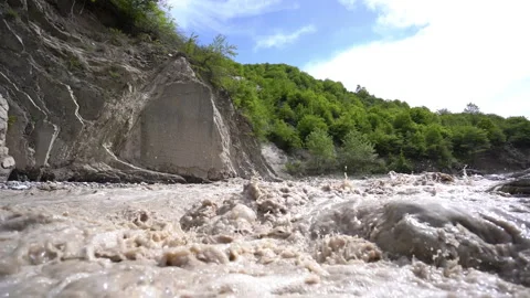 Mountain Stream Flooding with Rapid Water Flow Stock Footage 308963110
