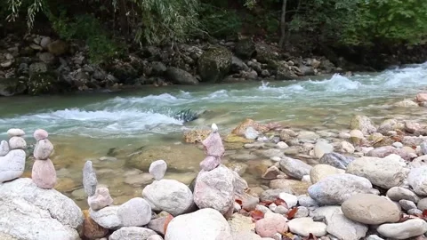 A mountain stream flowing along rocky shores Stock Footage 163656804