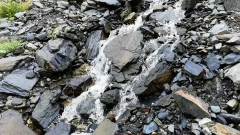 Mountain stream flowing from mountain slopes Stock Footage 174851114