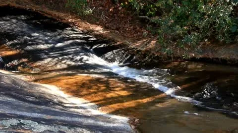 Mountain stream flowing over rocks Stock Footage 8972138