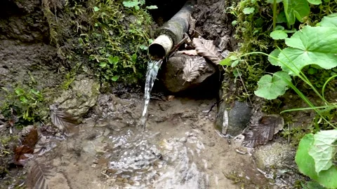 A mountain stream flowing through a pipe Stock Footage 242375435