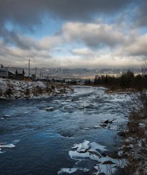 A mountain stream flows at the foot of the Zigalga Range Foto stock