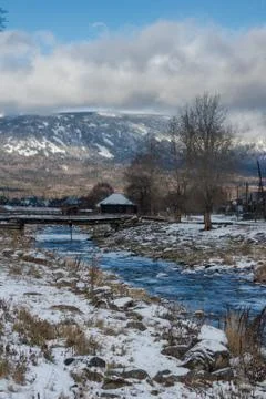 A mountain stream flows at the foot of the Zigalga Range Stock Photos
