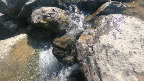 Mountain stream flows in stones Stock Footage 162346008