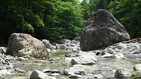 A mountain stream with huge rocks 스톡 동영상 260833377