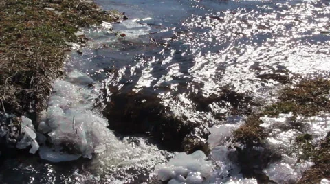 Mountain stream with melting snow Stock Footage 34913623