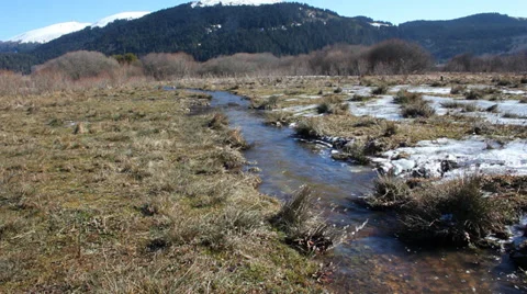 Mountain stream with melting snow Stock Footage 34946643