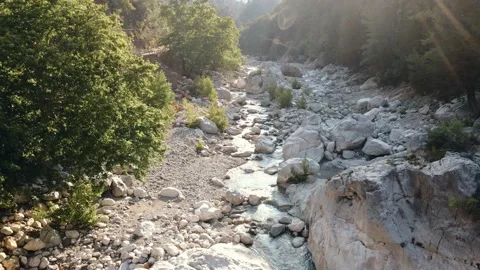 Mountain stream, rocky relief at sunset. Beautiful landscape. View from above. Video stock 161733149