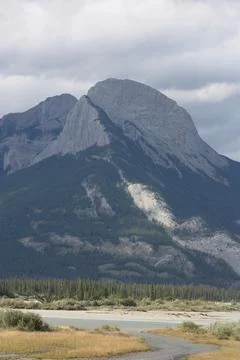 A Mountain with a stream running through it. Stock Photos