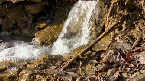 Mountain stream with a small waterfall on the slope Stock Footage 152845979