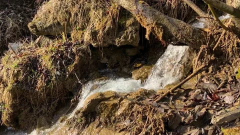 Mountain stream with a small waterfall on the slope Stock Footage 152846092