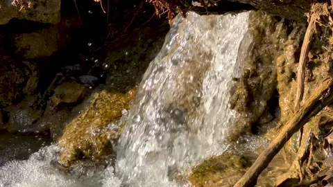 Mountain stream with a small waterfall on the slope Stock Footage 152846266