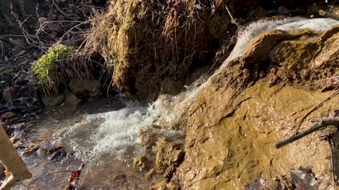 Mountain stream with a small waterfall on the slope Stock Footage 152846384