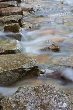 Mountain stream stepping stones Stock Photos