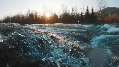 Mountain stream at sunset Waterfall on a mountain river Stock Footage 106530522