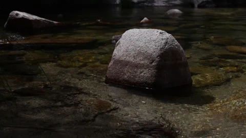 Mountain Stream Surrounding Granite Boulder in Sierra de Guadarrama Stock Footage 336666459