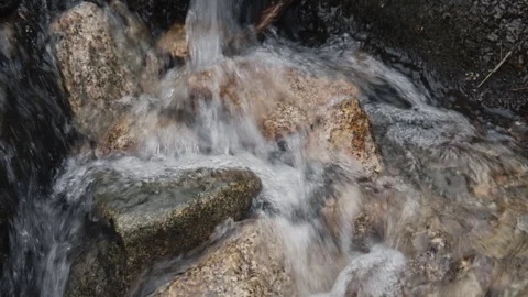 Mountain stream water flowing over rocks Stock Footage 331795521