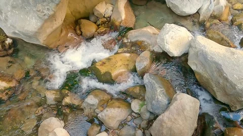 Mountain stream water flows among the stones, slow motion Stock-Footage 242349953