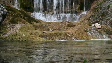 A mountain stream with a waterfall Video stock 217382829