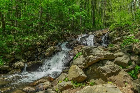 Mountain stream waterfall Stock Photos